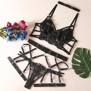 Sexy black lace lingerie set with embroidery, strappy harness bra and matching garter belt