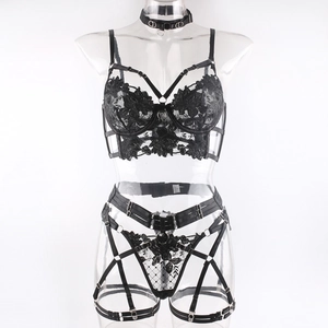 Detail of black lace lingerie set featuring floral embroidery and gothic metal rings