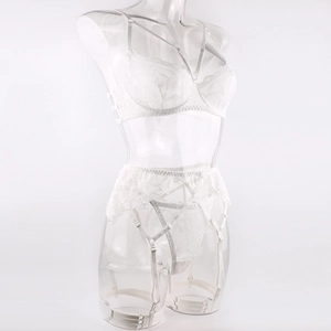 Detailed view of white lace lingerie set featuring garter belt and strap accents