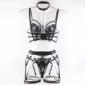 Detail of floral lace embroidery and metal buckle straps on black sexy lingerie set