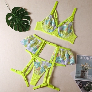 Detailed embroidery of floral lace on sheer lime lingerie set with adjustable straps