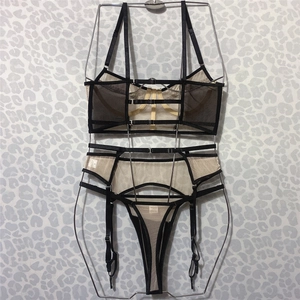 Three-piece black lace and mesh lingerie set with underwired bra and garter belt