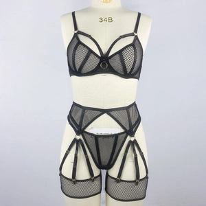 Detail of black mesh lingerie set with steel rings, cut-out lace and metallic ring accents