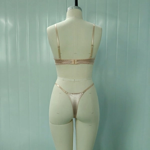 Back view of champagne satin lingerie set with adjustable straps on a mannequin