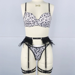Detail of leopard print lingerie set with underwire bra and black feather garter belt