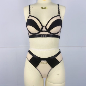 Detail view of mesh patchwork lingerie set with adjustable straps on a mannequin