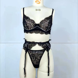 Three-piece black floral lace lingerie set with rhinestone trim and garter belt