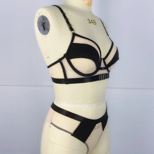 Detailed side view of black sheer mesh lingerie set with cutout bra and adjustable straps