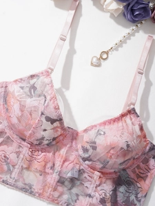 Detail of pink floral lace bustier bra with steel underwire and soft fabric texture