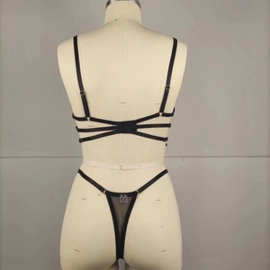 Rear view of black sheer mesh lingerie set with intricate multi-strap design on mannequin