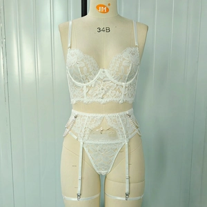 Detail of white lace corset with pearl chain and garter belt on a 34B mannequin
