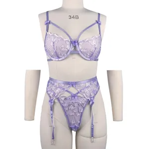 Purple lace lingerie set with white butterfly embroidery and garter belt on mannequin