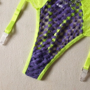 Detail of neon lace lingerie set featuring purple mesh and decorative silver metal chain