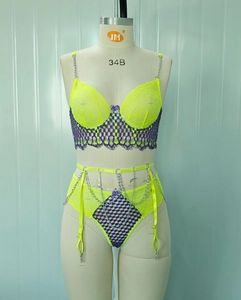 Lace lingerie set featuring neon yellow and purple lace with silver chain straps and bow detail