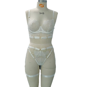 Sexy white lace lingerie set with eyelash lace bra and leg garter belts on model