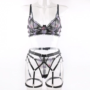 Detail of fireworks embroidery on black sheer lace lingerie set with adjustable straps