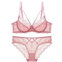 Detailed view of pink lace lingerie set featuring underwire bra and sheer lace panties