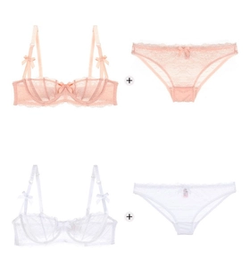 Detailed view of pink and white lace lingerie sets with delicate floral embroidery and bows