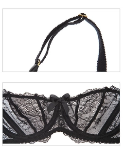 Detail of luxury black floral lace lingerie with adjustable gold buckles and bow