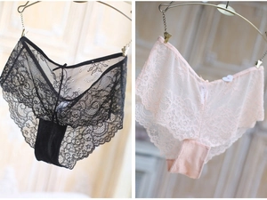 Detailed view of floral lace panties with scalloped edges and bow knot in black and pink