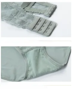 Detail of three-row hook closure and breathable cotton crotch on green lace lingerie