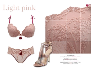 Detailed view of light pink floral lace lingerie set featuring tassels and embroidery
