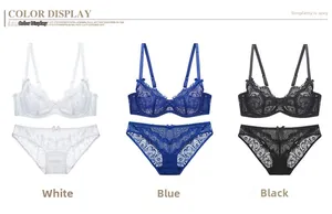 Detailed view of delicate lace embroidery and bow accent on women's lingerie sets