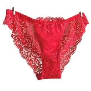 Detailed view of red floral lace panties with scalloped edges and high-quality texture
