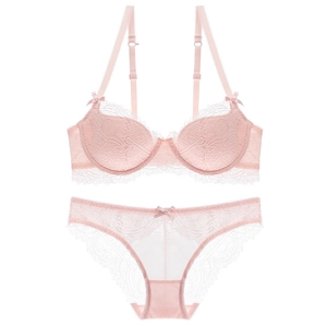Pink French lace lingerie set with push-up bra and matching floral panty on white background