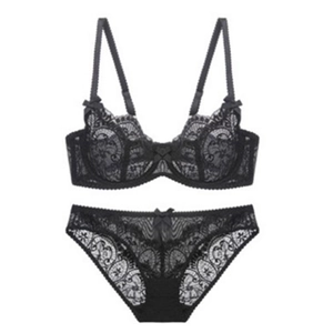 Lace bra and panty set in black featuring intricate floral patterns and bow details