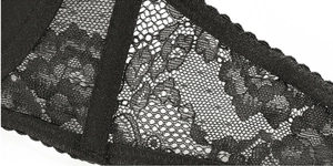 Gros plan sur la broderie florale de lingerie en dentelle noire avec bretelles élastiques