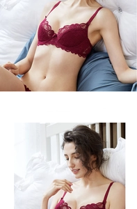 Close-up of wine red lace bra with floral patterns and adjustable straps detail
