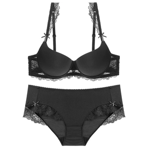 Elegant black lace lingerie set with push-up bra and matching panties on white background