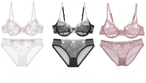 Completi reggiseno e slip in pizzo ricamato nei colori bianco, nero e rosa con rete