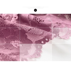 Close-up of elegant lavender floral lace fabric with delicate scalloped edges and mesh texture