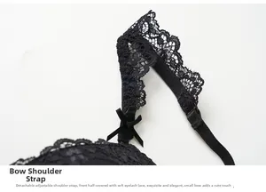 Detail of black adjustable shoulder strap with bowknot and delicate eyelash lace