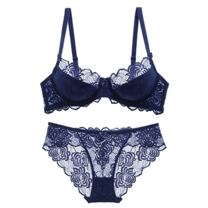 Dark blue lace lingerie set featuring sheer floral mesh bra and matching bow panties