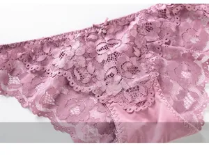 Detailed macro view of sheer floral lace and bow detail on low-rise panties