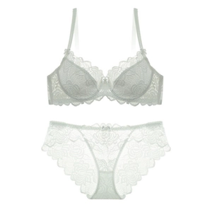 Elegant white lace bra and panty set with bow detail on a plain white background