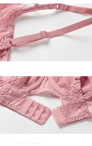 Detail view of pink lace bra with adjustable straps and breathable mesh fabric texture