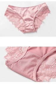 Detail view of pink satin underwear with delicate floral lace trim and eyelash edges