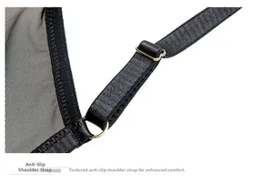 Detailed view of black lingerie strap with non-slip texture and golden metal buckle