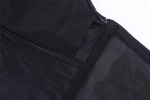 Close-up of black breathable mesh lining with removable pad insert for women's bra