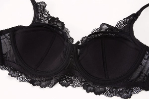 Detailed view of black lace bra with soft underwire support and breathable cup lining