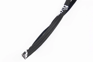 Detail of black seamless bra strap with white geometric print and reinforced stitching