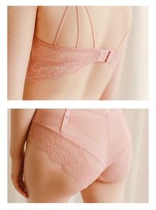 Detailed view of pink lace bra back straps and matching sheer floral mesh panties set