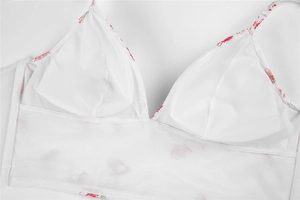 Detail of white mesh bra lining with removable pads and floral pattern print