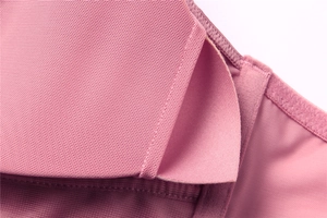 Detail of pink wire-free bra showing breathable mesh fabric and fine inner stitching
