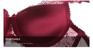Macro detail of wine red lace bra featuring push-up padding and breathable texture
