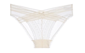 Detail view of lace panties featuring cross-strap waist and scalloped floral edges